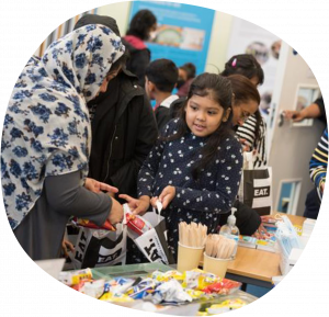 People preparing food for packing