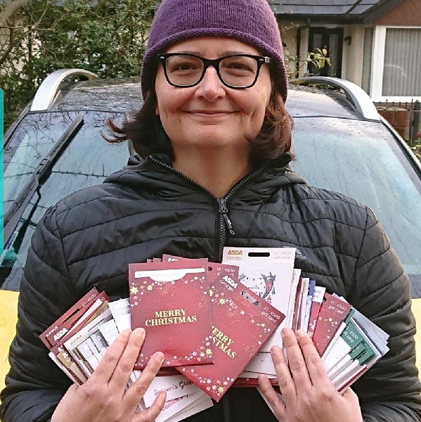 Sam with vouchers for customers