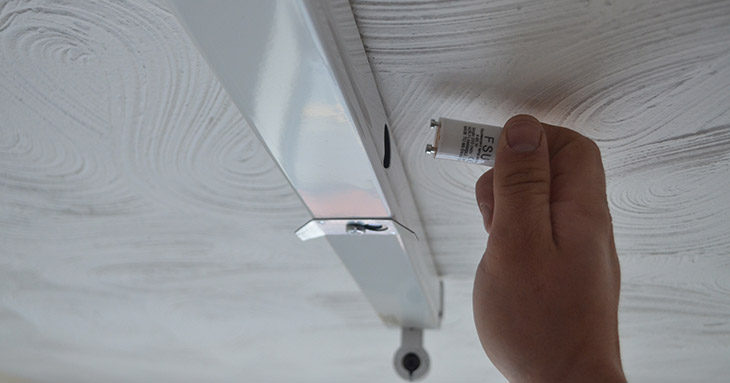 Image showing changing a starter for a florescent light